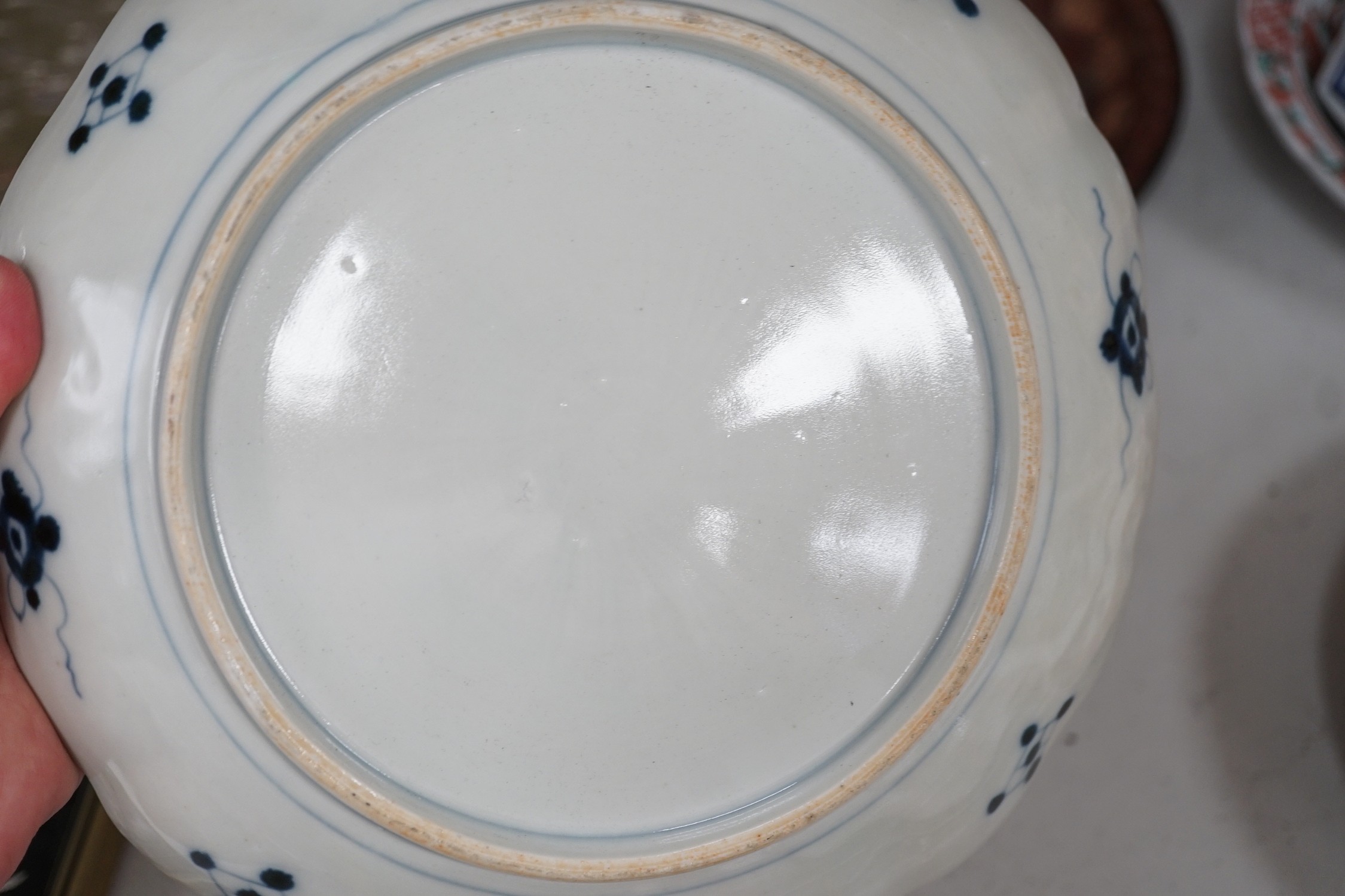 A group of 19th/20th century Japanese porcelain and pottery dishes. Largest 33cm diameter